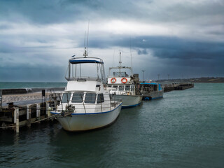 Fototapeta premium Boats Moored On Pier Side