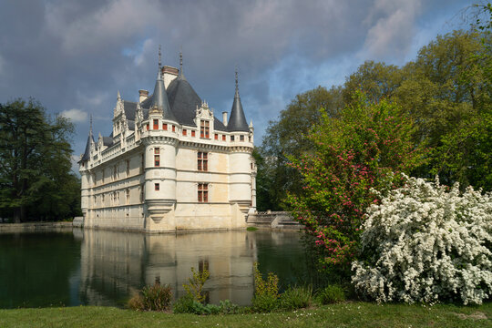 View of the Azay-le-Rideau Castle, a medieval castle above the bend of the Indre river, in the commune of the same name on a sunny summer day, Indre-et-Loire, France