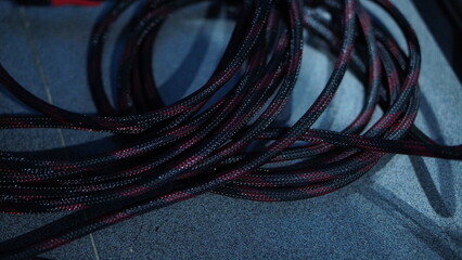 High-Resolution Close-Up of Black and Maroon Braided Cables