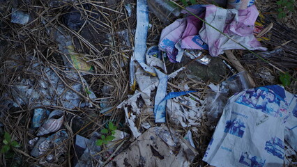 Environmental Pollution A Close-Up View of Litter and Debris in a Natural Setting