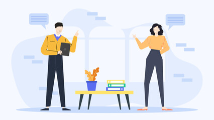 Two people conversing beside a table with binders; ideal for communication, teamwork, business meetings, office culture, collaboration concepts.