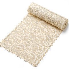 Roll of lace table runner in ivory