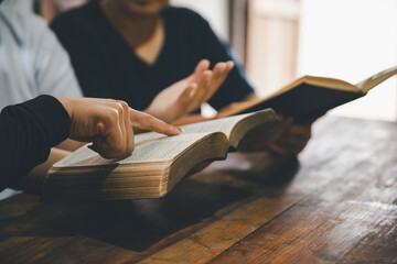 Praying religion, worship and group of people pray to God, Family, holding hands and prayer in home...