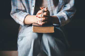 Christian woman reading bible in ancient Catholic temple. Reading Holy Bible in temple. Concept for...