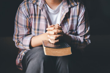 Christian woman reading bible in ancient Catholic temple. Reading Holy Bible in temple. Concept for...