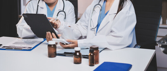 doctors and nurse having informal meeting in hospital canteen