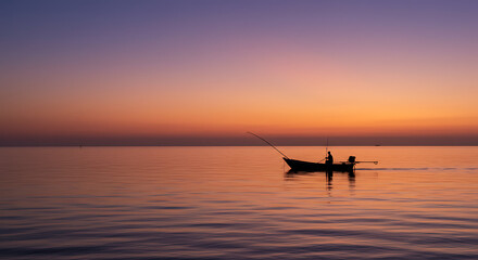 Fototapeta premium Serene Sunset Silhouette Fisherman in Small Boat at Sea Golden Hour