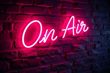 Neon sign on brick wall reads "on air".