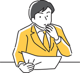 書類を見て考えるビジネスマン