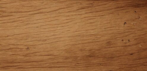 Closeup view of light brown wooden surface with visible grain, texture, and small holes, shot from topdown perspective.