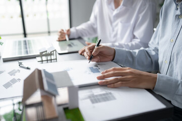 Solar panels green energy Business man working green eco friendly office business creative idea Planing Bio economy for business eco friendly professional Engineer sustainable electricity.