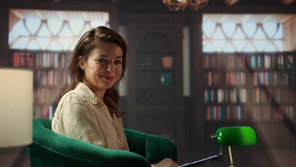 Portrait of woman counselor preparing for a session with client in the cabinet, discussing about...