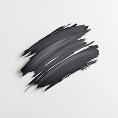 Abstract black paint stroke on a white background for creative designs.