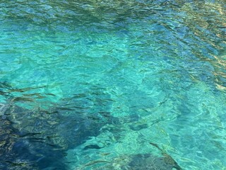 Sea blue clear ripples surface water background.