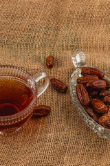 Enjoying tea and dates on a burlap tablecloth