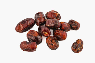 Dried dates displayed on a clean surface with rich texture