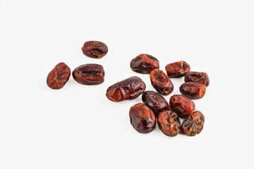 Dried dates on a light surface ready for snacking