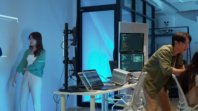 Professional computer engineer working on a new software technology design in the office Night, focus or programmer review search engine process, software or IT database development