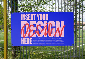 White mockup template info panel displayed on a fence near a sports field.