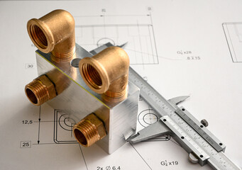 Plumbing fixture undergoing quality control with a caliper on a blueprint, ensuring precise measurements and adherence to specifications