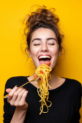 Happy woman eating spaghetti and smiling at the camera