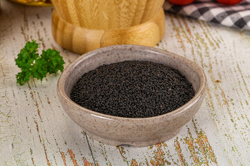 Black dry Nigella seeds in the bowl