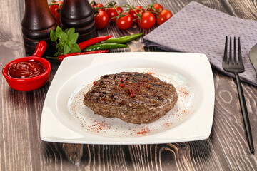 Grilled beef burger cutlet with sauce