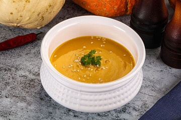 Vegan pumpkin cream soup served sesam
