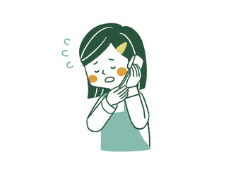 電話口で謝罪をしているエプロンを着用した女性