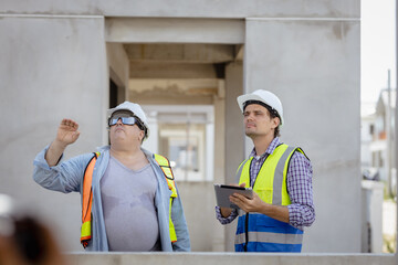In the Industrial Engineering Facility: Diverse Group of Engineers, Technicians, and Specialists on a Meeting, Have Discussion, Analyse Engine Design Technical Drafts that are Lying on the Table