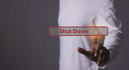 Young man hand touching Shut Down button press power OFF