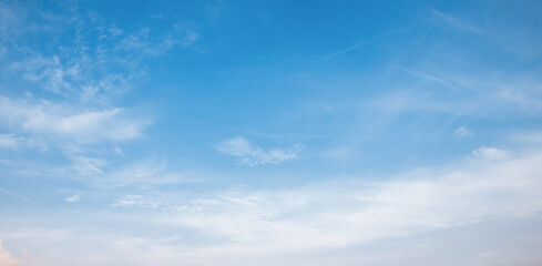 the sky is full of fluffy white clouds, bright and beautiful, no one else is there.