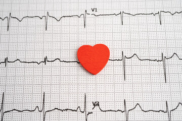 Red heart on electrocardiogram ECG with red heart, heart wave, heart attack, cardiogram report.
