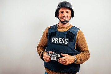 Reporter in bulletproof vest with a camera.