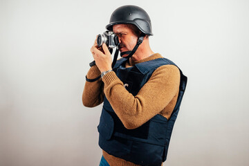 Reporter in bulletproof vest with a camera.