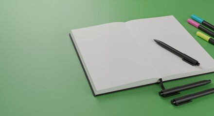 Open notebook with black pen and colorful markers on green background  