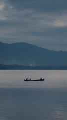 Boat on Lake with Mountains
