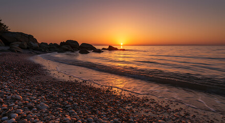 Stunning Seascape Sunrise over Rocky Beach with Seashells at Golden Hour