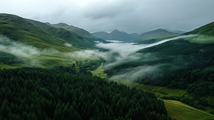 Aerial view of misty mountains and forest landscape in scotland highlands nature travel destination