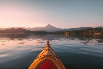 Kayaking adventure at Smith Mountain Lake during sunset in Virginia with mountain background