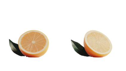 Two halved citrus fruits, one pale orange, one pale yellow, each with a dark green leaf beside it, on a black background