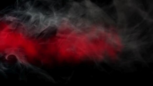 Red and white  smoke moving on black background. Colored smoke or fog in red color effects. Perfect for backgrounds and wallpapers.
