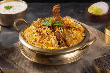 Authentic Hyderabadi Chicken Dum Biryani in a Traditional Brass Pot with Raita and Salan - Traditional Photoshoot of a Chicken Biryani