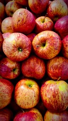 Close-up view of glossy red apples for sale at supermarket
