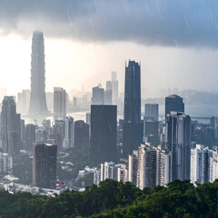 Obraz premium Dramatic Rainstorm Over Modern City Skyline High Rise Buildings Urban Landscape