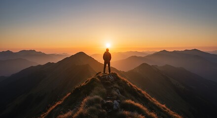 Fototapeta premium Inspirational Hiker on Mountain Peak at Sunrise