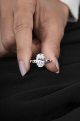 woman elegant finger ring with white diamond 
