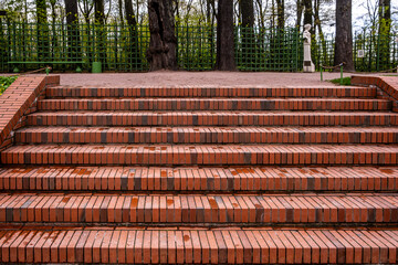 Wide brick staircase in the park on a summer day.