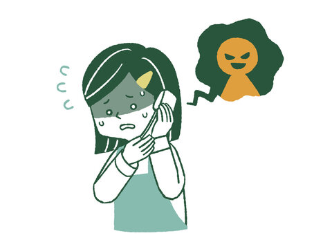 悪意のある電話を受けるエプロンを着用した女性
