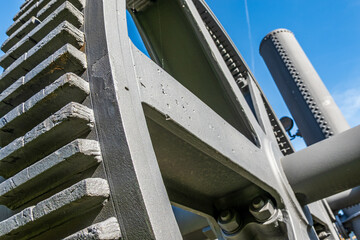 Detailed view of interlocking gears working together in a mechanical system during daylight